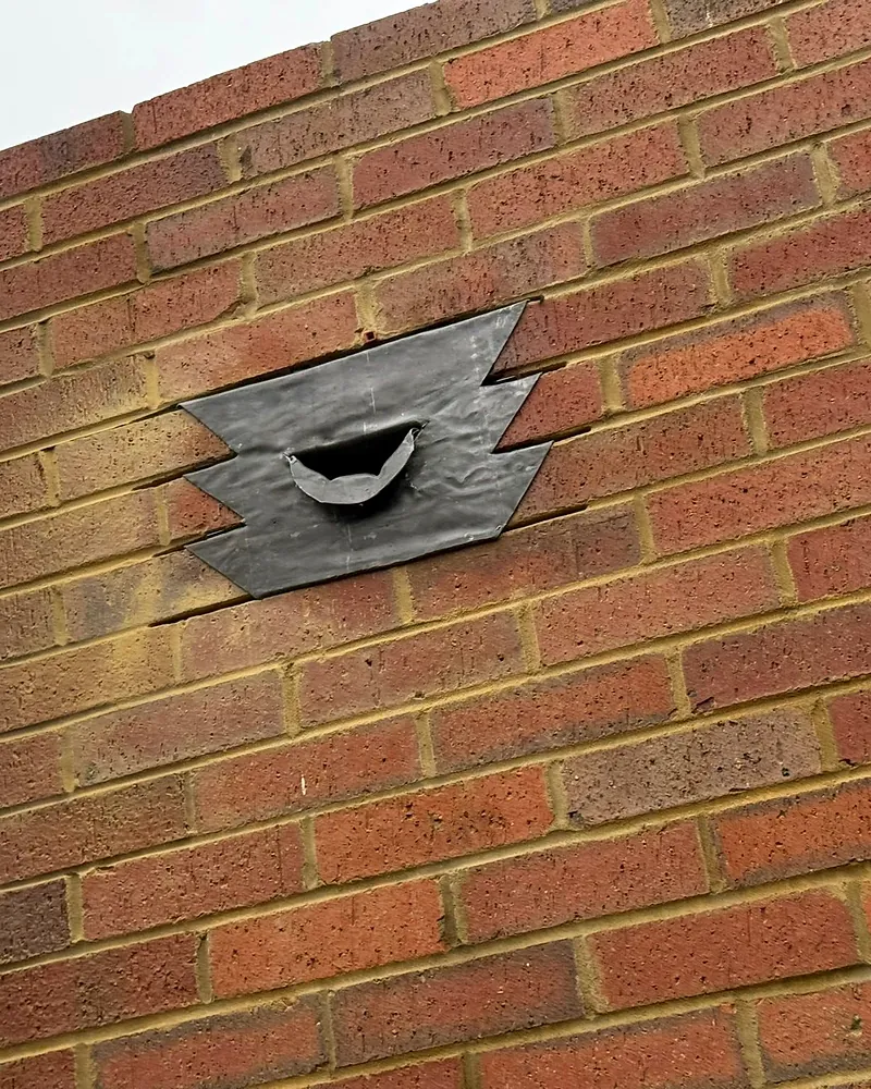 Lead flashing into brickwork